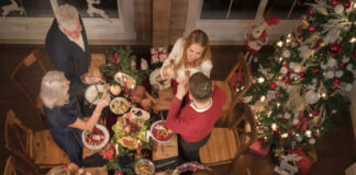 people enjoying festive christmas dinner together 618x412.jpg