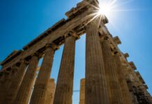 Sun over Parthenon Athenian Acropolis 3 4 perspetive rear facade. Athens Greece 620x350.jpg