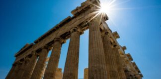 Sun over Parthenon Athenian Acropolis 3 4 perspetive rear facade. Athens Greece 620x350.jpg