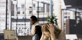 stressed businesswoman faces migraine from corporate pressure 618x412.jpg