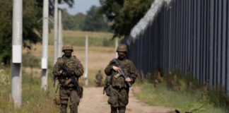 poland belarus border patrol reuters 1200x630.jpg