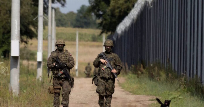 poland belarus border patrol reuters 1200x630.jpg