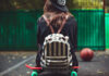 young girl sitting plastic orange penny shortboard asphalt cap 618x412.jpg