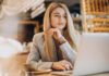 business woman sitting cafe working online 618x412.jpg