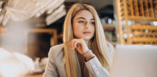 business woman sitting cafe working online 618x412.jpg