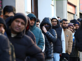 migrants reuters 1200x630.jpg