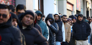 migrants reuters 1200x630.jpg