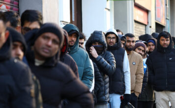 migrants reuters 1200x630.jpg