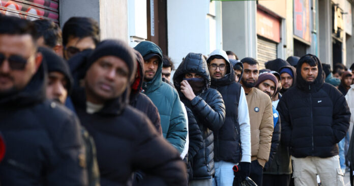 migrants reuters 1200x630.jpg