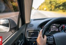 02b3bc4b woman drivers hands steering wheel inside car og.jpg