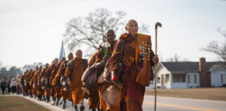 buddhist monks accosiated 1200x630.jpg