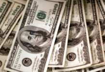 dollars banknotes reuters scaled 2 1200x630.jpg
