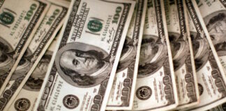 dollars banknotes reuters scaled 2 1200x630.jpg
