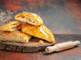 front view penovani khachapuri wood board rolling pin dark red table 618x412.jpg