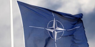 nato flag reuters 1200x630.jpg