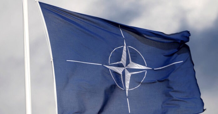 nato flag reuters 1200x630.jpg