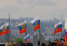 russia soldiers flags reuters 1200x630.jpg