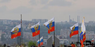 russia soldiers flags reuters 1200x630.jpg