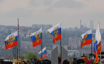 russia soldiers flags reuters 1200x630.jpg